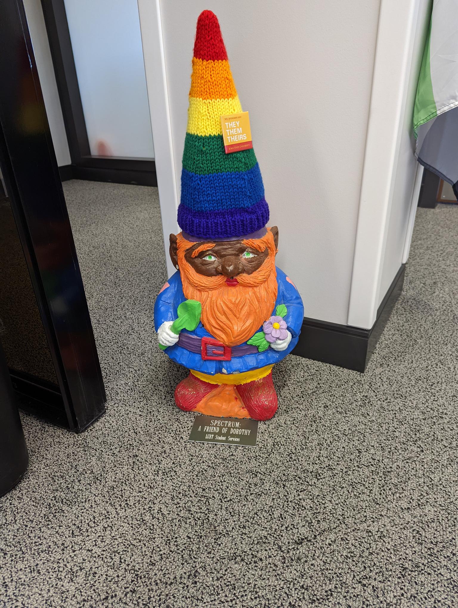 Spectrum the Gnome that lives at the center decorated with rainbow colored attire